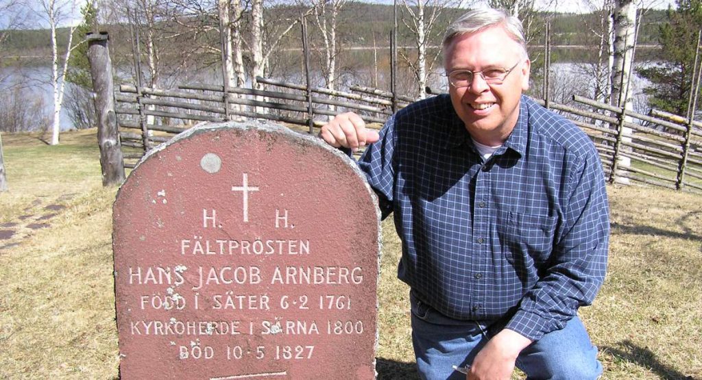 Terry in front of forefathers gravestone